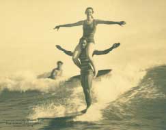 Three persons surfing