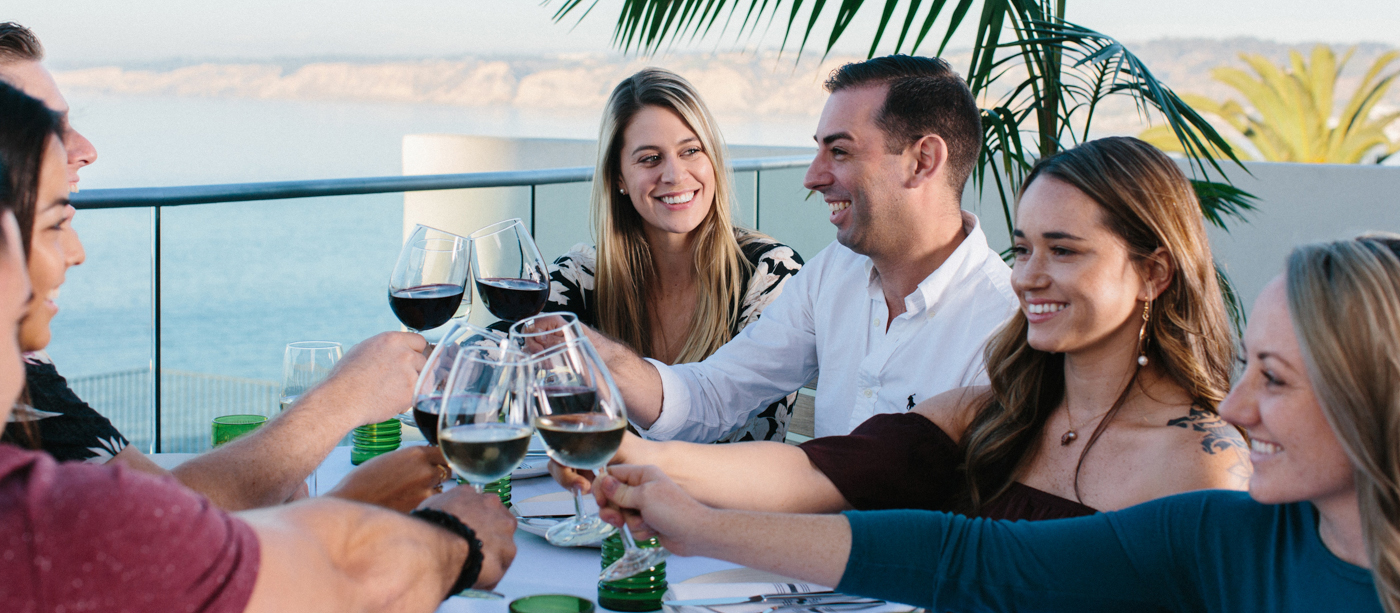 A group of people drinking wine