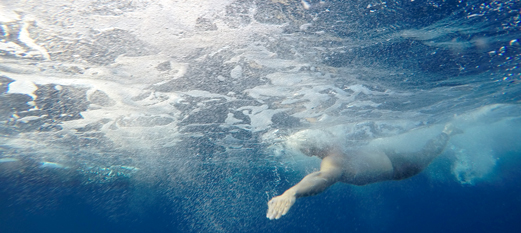 Underwater view of person swimming