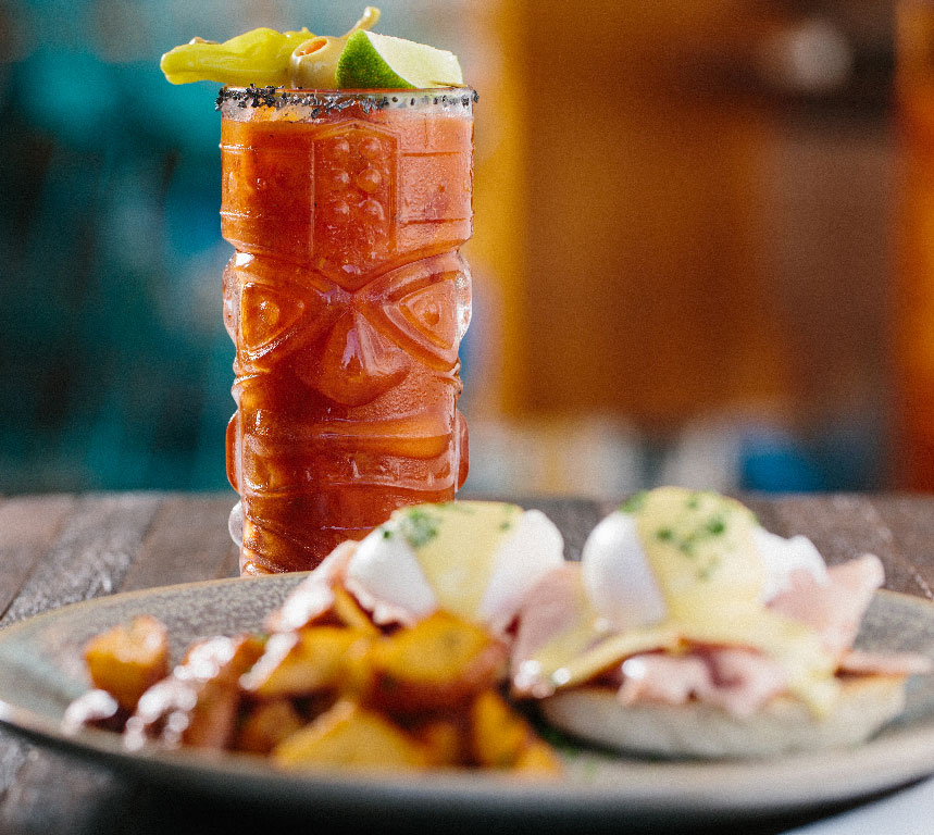 photo of a breakfast cocktail and sandwich